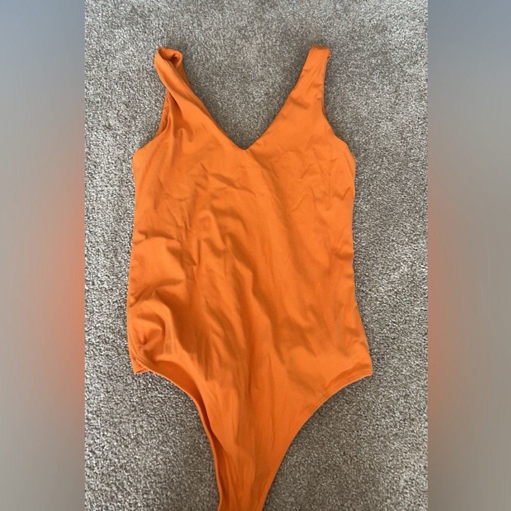 Orange small bodysuit